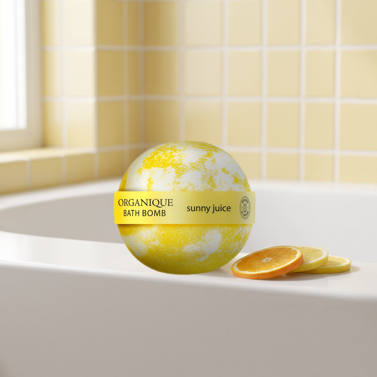 Bath Bomb – Sunny Juice on the rim of a bathtub with orange and lemon slices