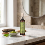 Feel Up Spray Conditioner 125 ml on a marble vanity with a wooden hairbrush and matcha
