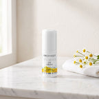 Pumpkin Hydrating Eye Cream 20 ml on a white marble vanity with a face cloth and chamomile