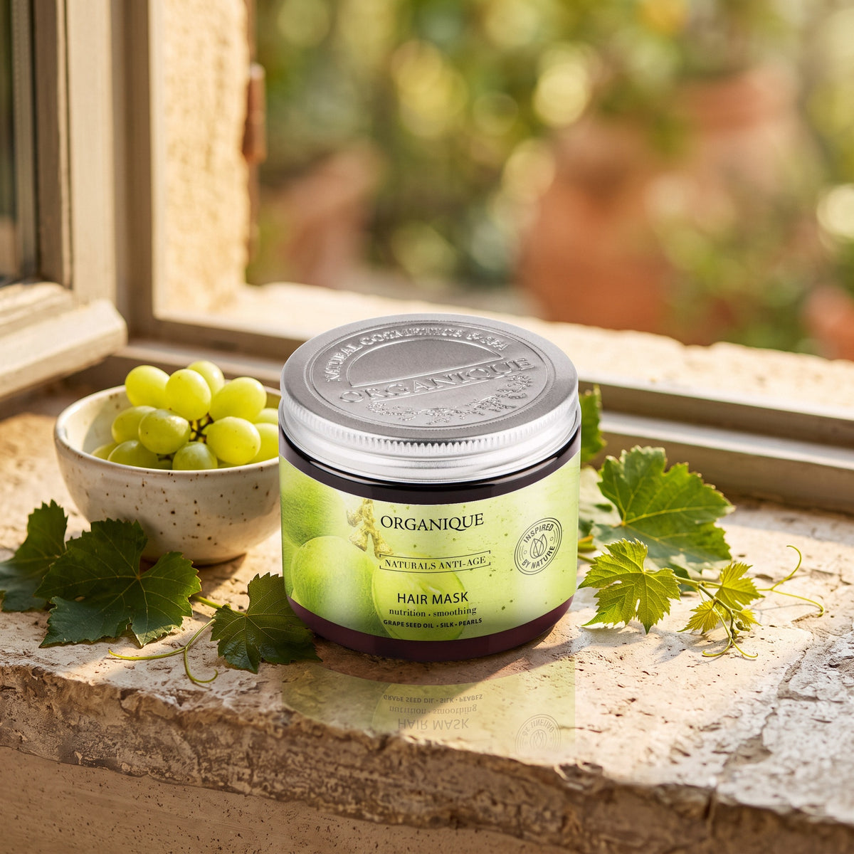Naturals Anti-Age Hair Mask 200 ml on a stone windowsill with green grapes and vine leaves