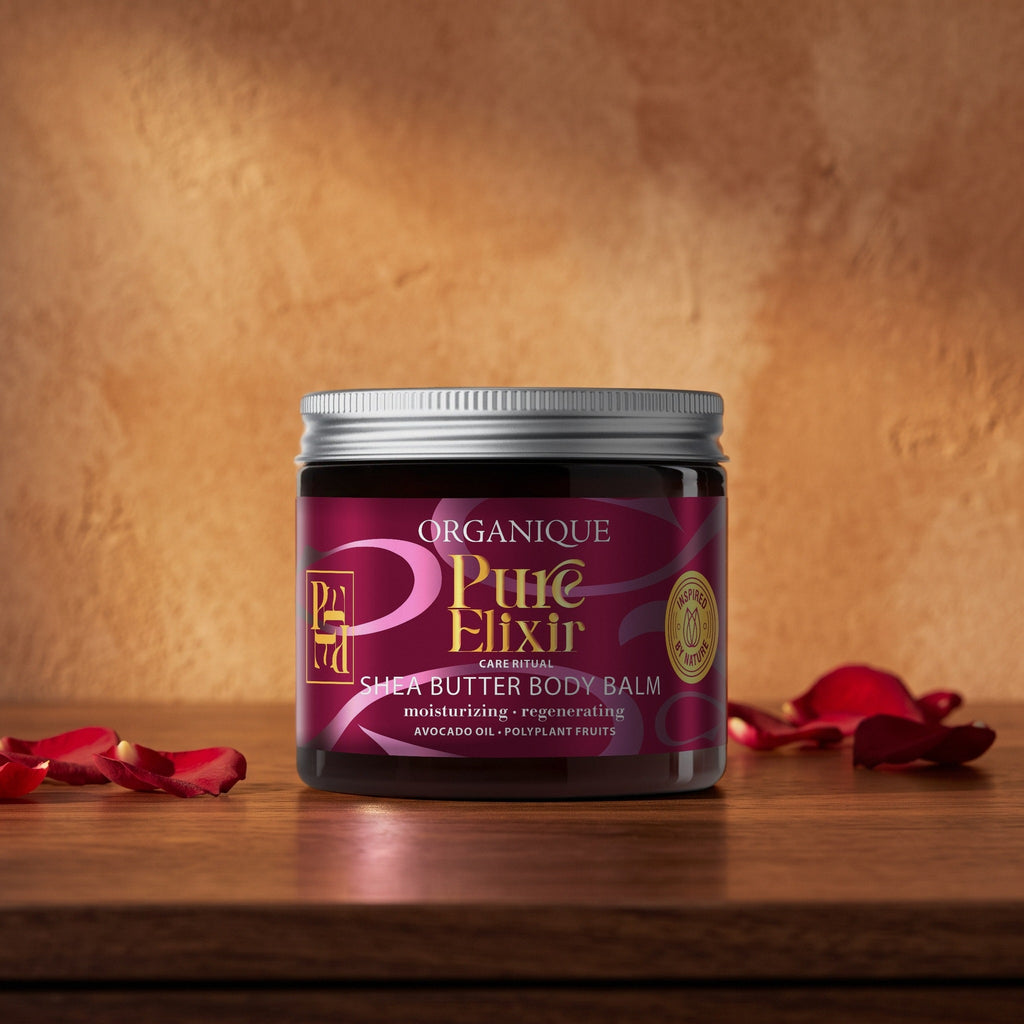 Pure Elixir Shea Butter Body Balm 200 ml on a walnut vanity with red rose petals