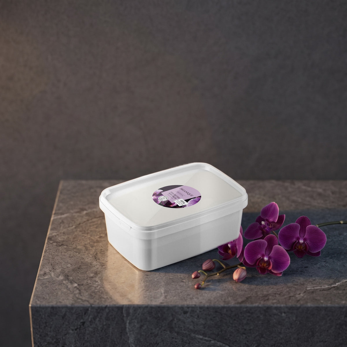 Shea Butter Body Balm – Black Orchid 1 kg on a dark stone vanity with purple orchids